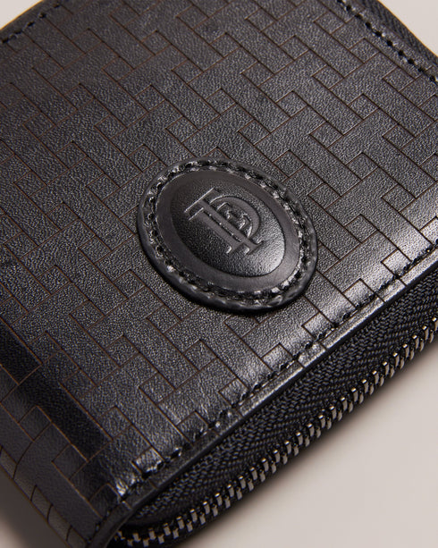 TOBIAT-Wallets-Take your style from casual to elevated with TOBIAT. With a zip-around fastening, inside pocket and multiple card slots, you’ll be able to hold on to all your essentials with ease.By purchasing this product, you are supporting responsible leather manufacturing through the Leather Working Group. Wallet Leather T monogram texture Zip around fastening Card slots Inside pocket Ted Baker branded embellishment Dimensions: 2cm x 9cm x 11cm- Ted Baker Romania